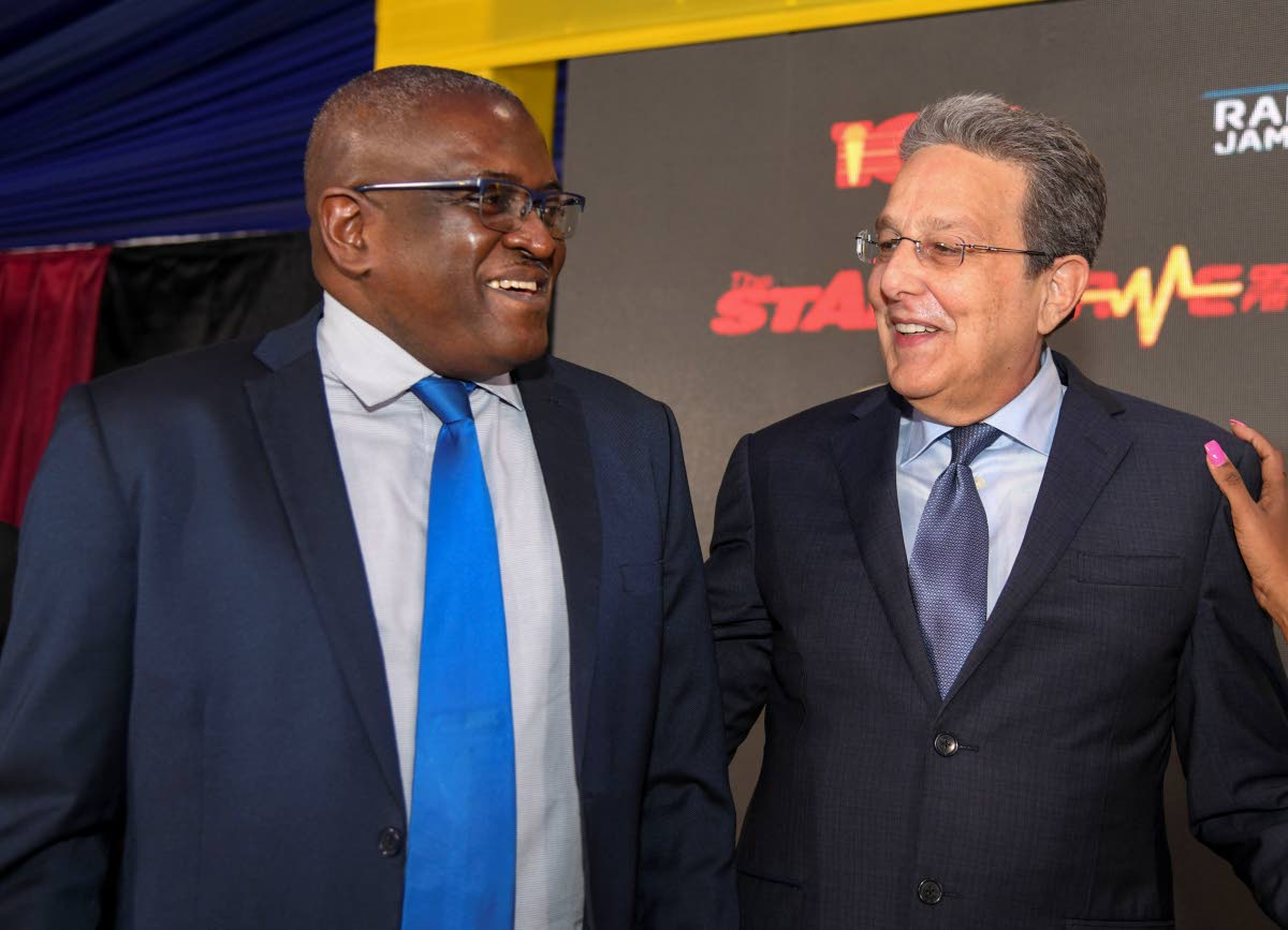 Chief Executive Officer Anthony Smith (left) in conversation with Chairman Joseph M. Matalon at the RJRGLEANER Communications Group’s 76th Annual General Meeting, held on October 23, 2024 at the Terra Nova 
All-Sute Hotel in 
St Andrew. 