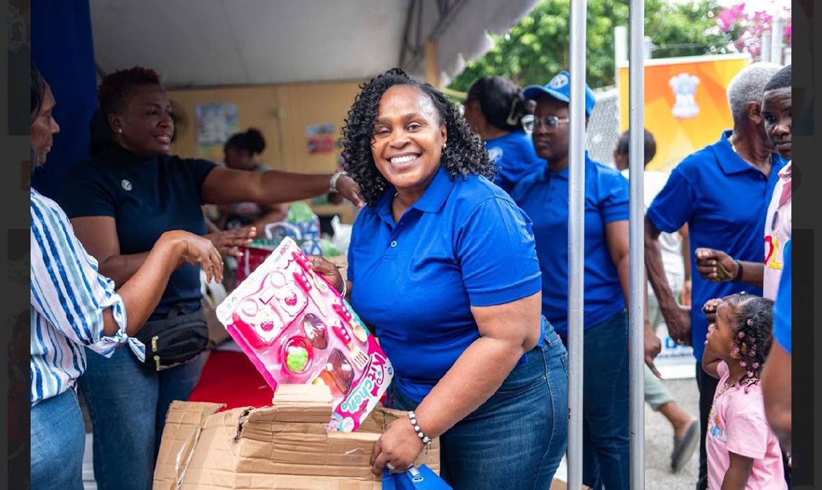 Distinguished President Jacqueline Bennett, prepares to hand out gifts, as part of the Kiwanis Club of West St Andrew’s Health and Wellness Fair, held at Laura’s Basic School. 