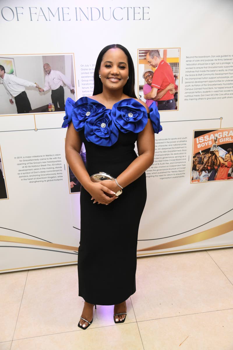 Keri-Ann Newman, senior manager of business development at Barita Investments, chooses a blue rose appliqué number from House of Style.