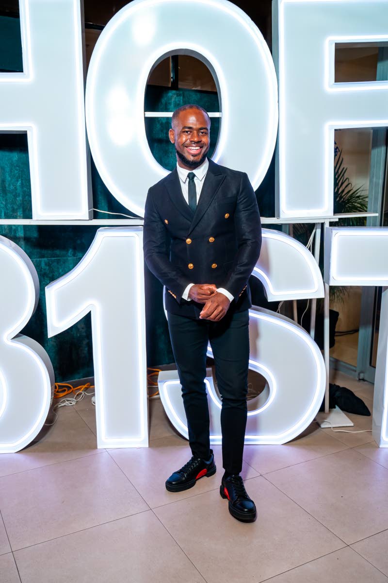 Mario Tibby, financial solutions manager at JMMB, adds a casual touch to his sharp look with kicks from Fierce by Dre.