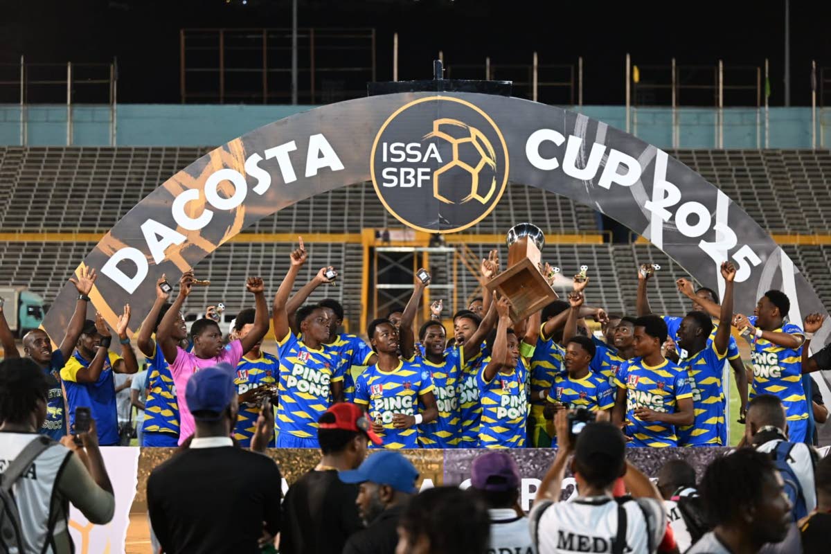 St Elizabeth Technical High School celebrate with the daCosta Cup trophy after edging Glenmuir High School on penalties in the final at the National Stadium on December 20, 2025.