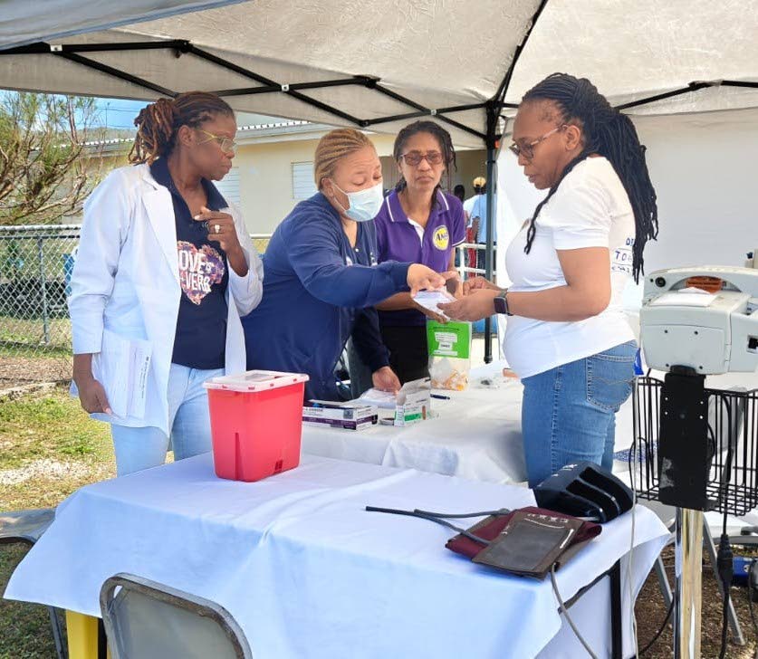 Dr Lisa Henry (second left), director of Nursing Services, Andrews Memorial Hospital Ltd, guided the triage process at the Hurricane Relief Health Clinic with Fredricka Coombs and Charmaine Blythe, laboratory manager and assistant laboratory manager at And