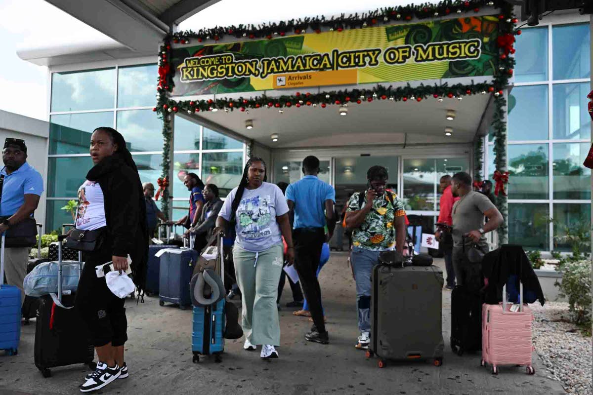 Travellers arriving in Jamaica at the Norman Manley International Airport in Kingston on Monday, three days before Christmas Day.