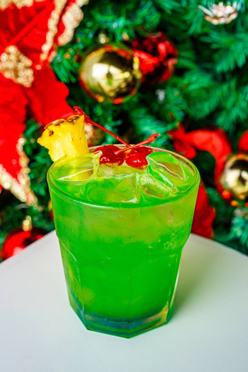 The lemon breeze is garnished with pineapple and cherries.