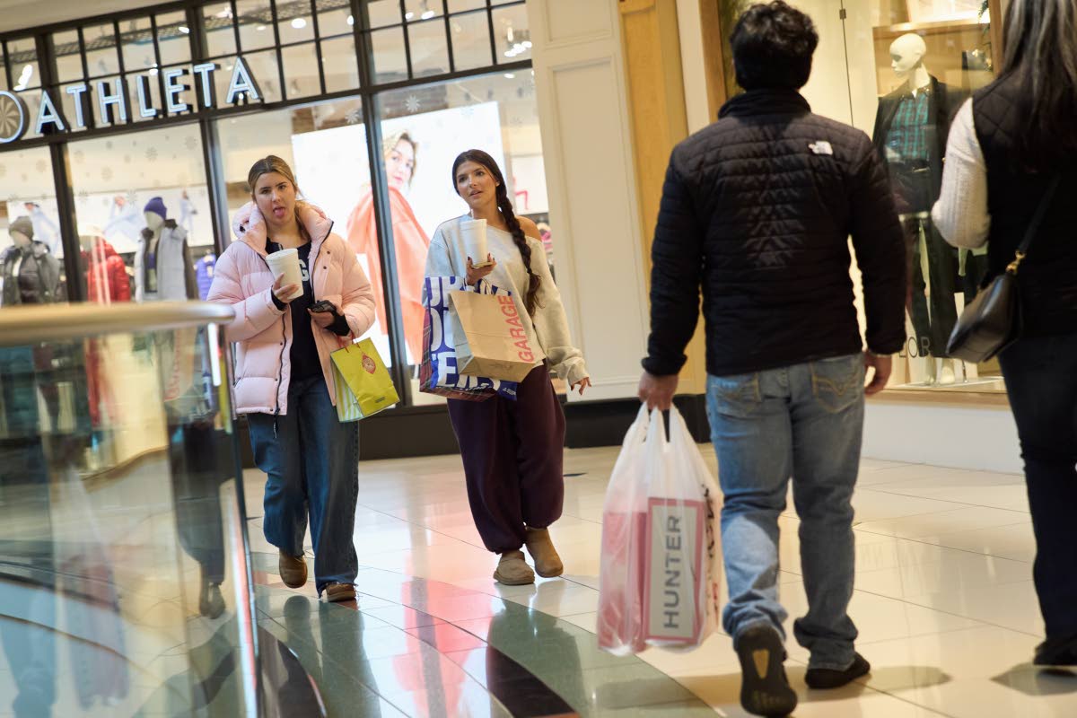  AP
Shoppers walk around the Somerset Collection mall on Wednesday, December 10, in Michigan, USA.