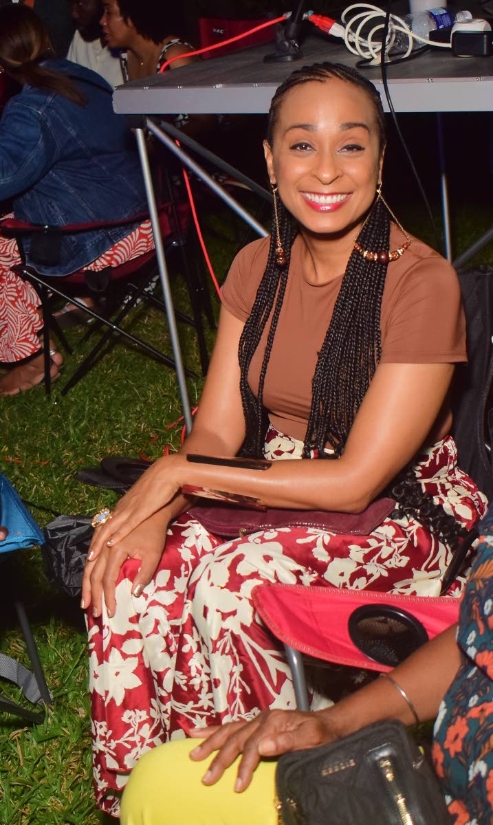 Left: We spotted reggae songbird Alaine enjoying the night’s performances as she showed her support.