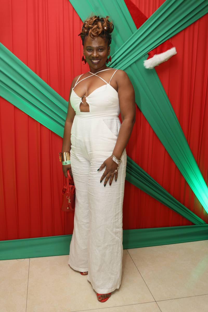 Tena Wilson-Davis, accountant, chose a white jumpsuit paired with red and gold accessories.