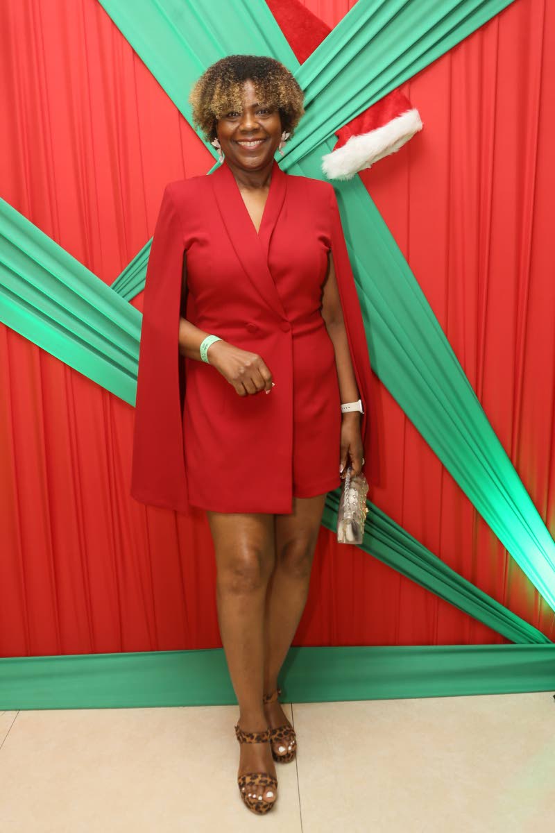 Marcia Osborne, group HRD and administration manager, Jamaica Co-operative Credit Union League, chose a festive red blazer dress with cape sleeves. 