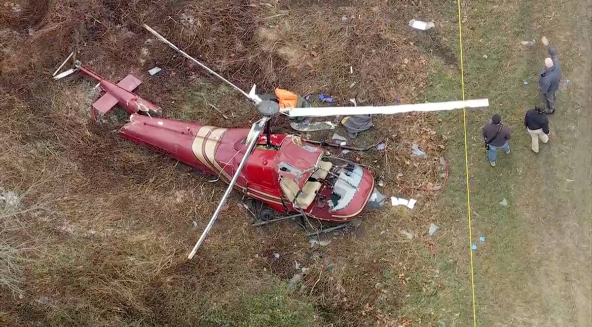 Authorities look over the scene after two helicopters crashed in Hammonton, N.J., on Sunday, December 28, 2025. (WPVI-TV/6ABC via AP)