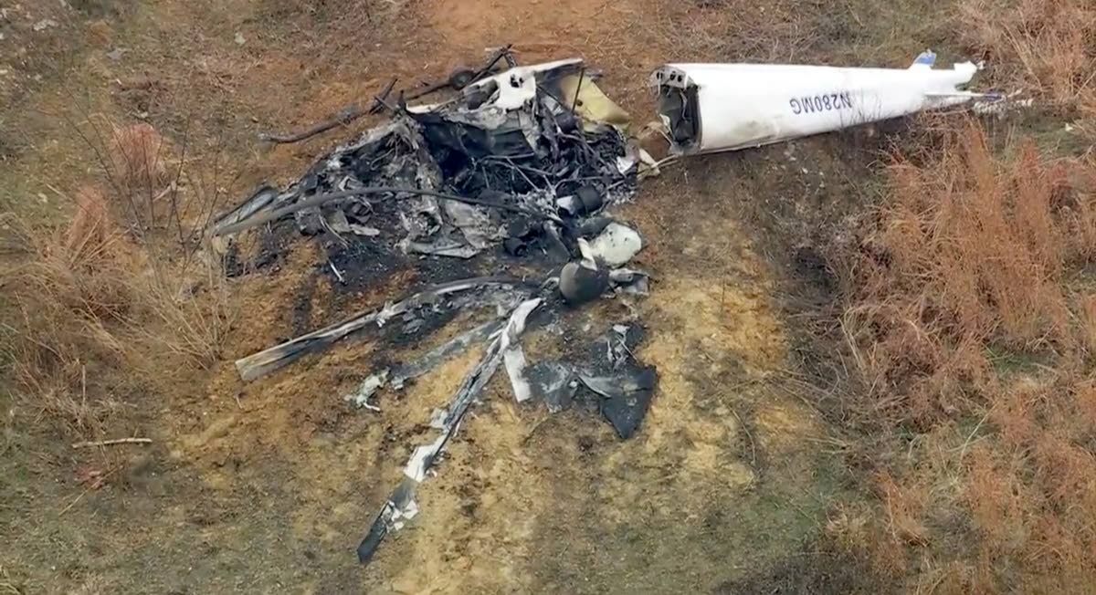 Debris from a helicopter is shown after two helicopters crashed in Hammonton, N.J., on Sunday, December 28, 2025. (WPVI-TV/6ABC via AP)