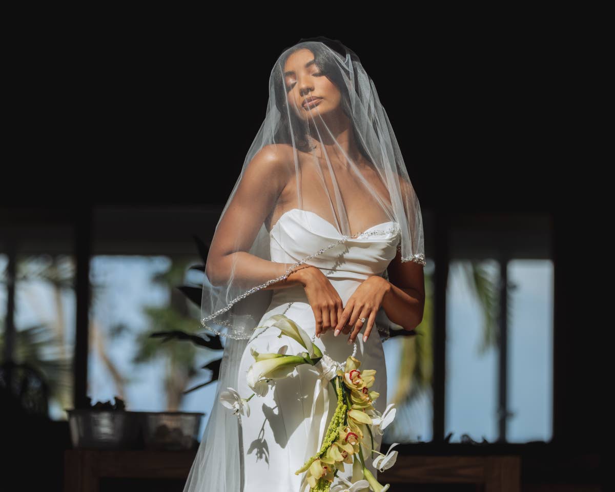 The beautiful bride, Jordanne wearing a fit-and-flare silk mikado gown by Allure Bridals.