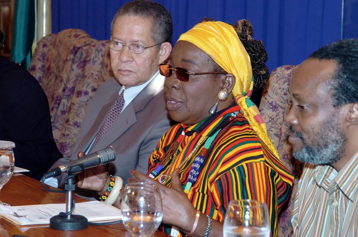 Rita Marley addresses the gathering during the official announcement in January 2008 of February as Reggae Month. The press conference was held at Jamaica House. At left, is then Prime Minister Bruce Golding.