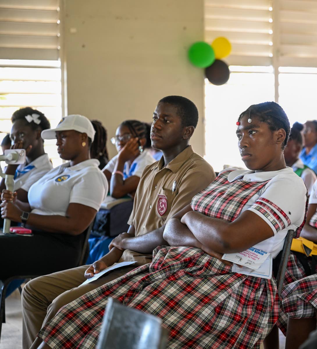 Students listen attentively during the launch of Miss St Thomas Festival Queen’s parish project.