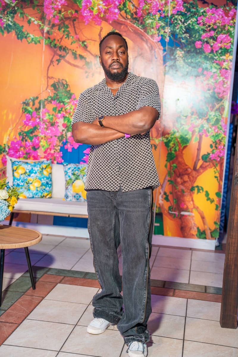 Business Instructor Shane Boothe shoots a cool pose for the camera.