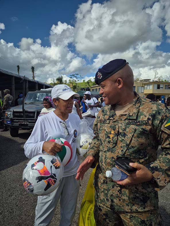 Lt Col C. A. Henry (right), commander of the Second Battalion of the Jamaica Regiment, Jamaica Defence Force, Western Command engages Dieka Morrison, executive director of Global Empowerment Mission (GEM) Caribbean, at the army’s 2025 Children’s Christ