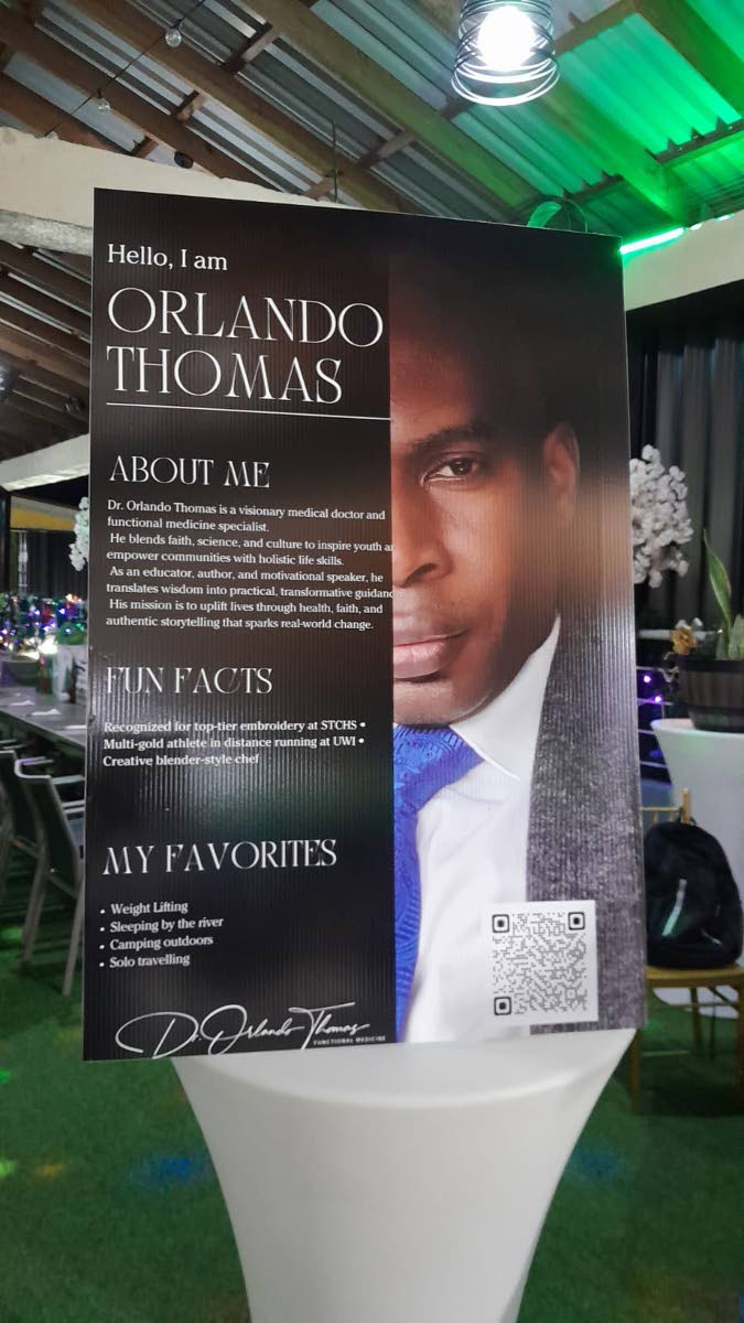 A featured author spotlight poster welcomes guests at the launch event for a newly released book by Dr Orlando Thomas.