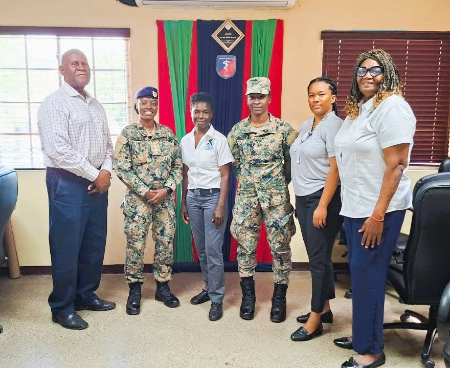 Members of the Jamaica Defence Force Health Services Corps with Northern Caribbean University representatives Dr  Grace Kelly (right), Philecia Vernon (second right), and Dr Venese Madden (fourth right).