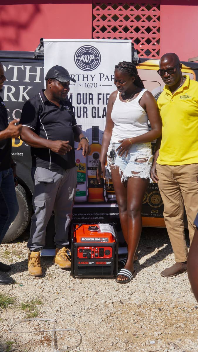 From left: Oneiko Green, Kimony Anderson and David Dixon, Worthy Park wholesale trade supervisor, at Ambala HQ, Newton in St Elizabeth.