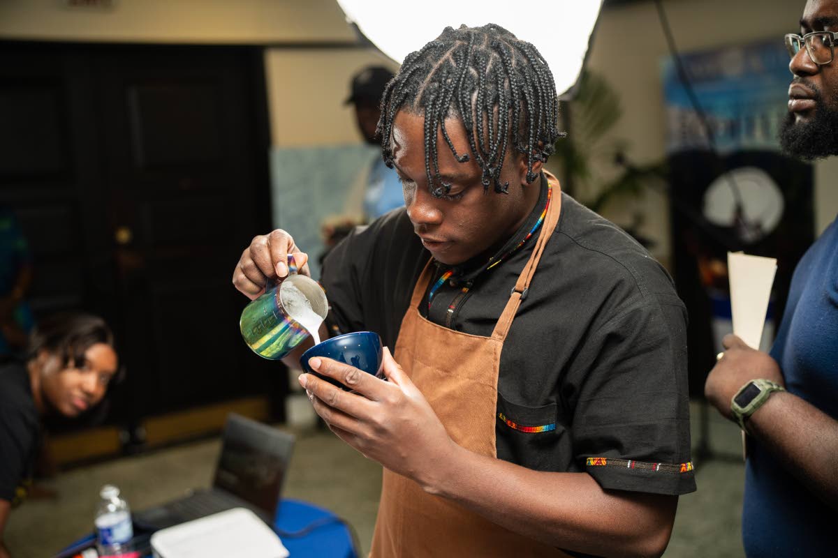 Left: Bailey remains focused as he prepares his latte for tasting while in competition. 