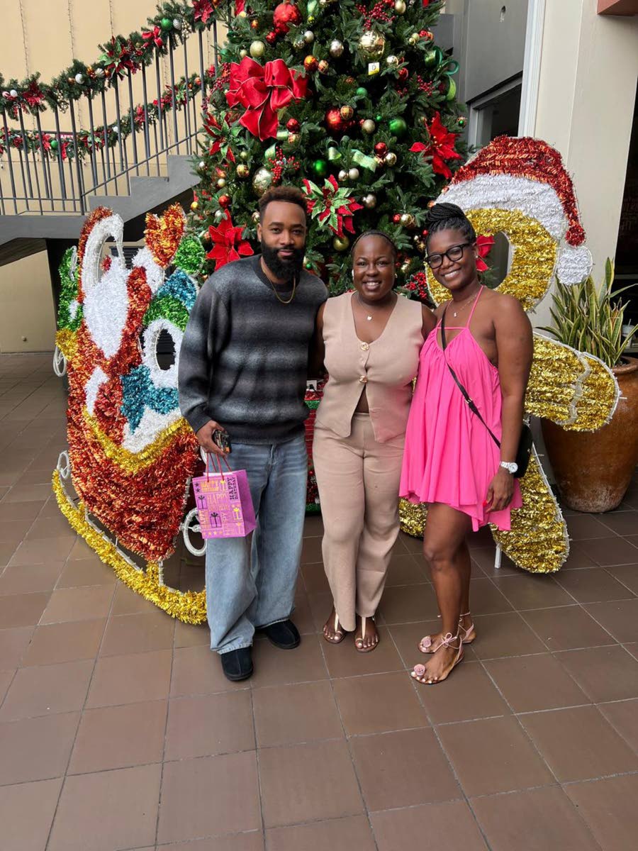 The social media influencer and educator was excited to reconnect with dance educator Shanelle Forsythe (centre) and attorney-at-law Kelisha Shaw.