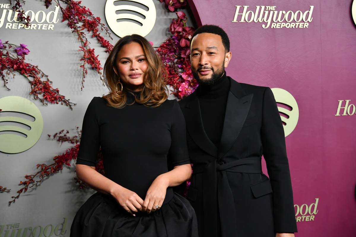 Chrissy Teigen (left), in Magda Butrym, and John Legend, in Valentino, match in all-black at the 83rd Annual Golden Globes Nominees Night. 