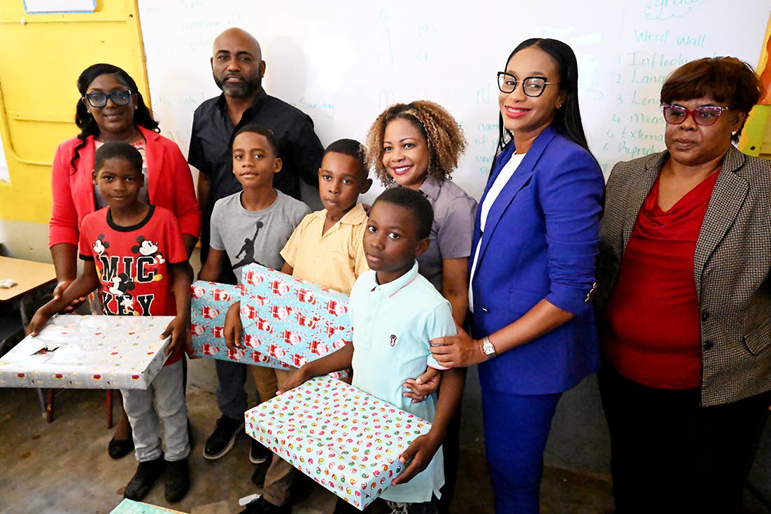 Minister without Portfolio in the Office of the Prime Minister responsible for Science, Technology and Special Projects, Dr Andrew Wheatley (second left, background); Minister of Education, Skills, Youth and Information, Senator Dr Dana Morris Dixon (third