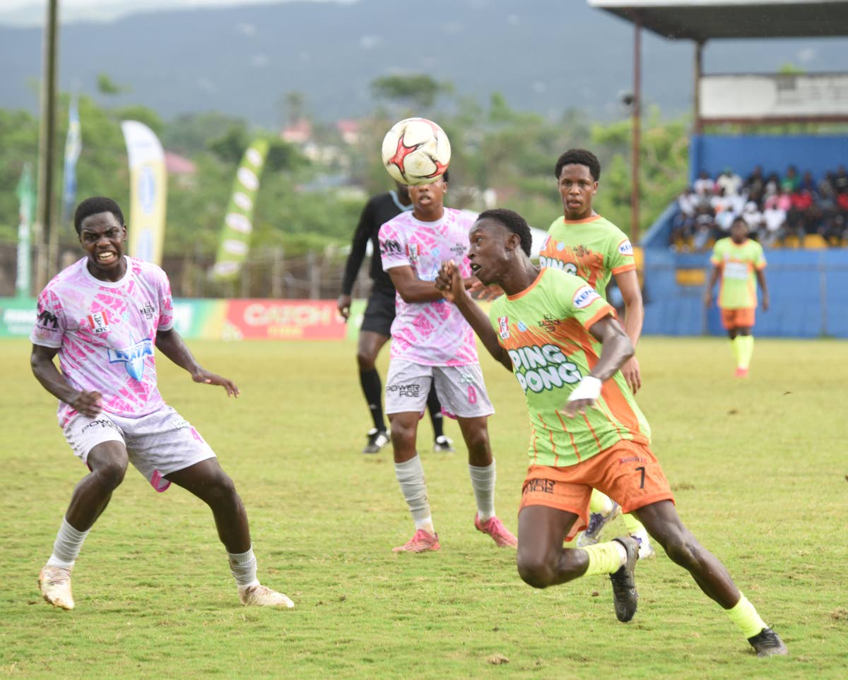 Ashley Anguin/Photographer 
All daCosta Selection and Cedric Titus’s Terron Eccleston (right) uses his head to control a ball while being closely watched by Kevaun Campbell during their ISSA All-daCosta vs All-Manning Selection football at the STETHS Spo