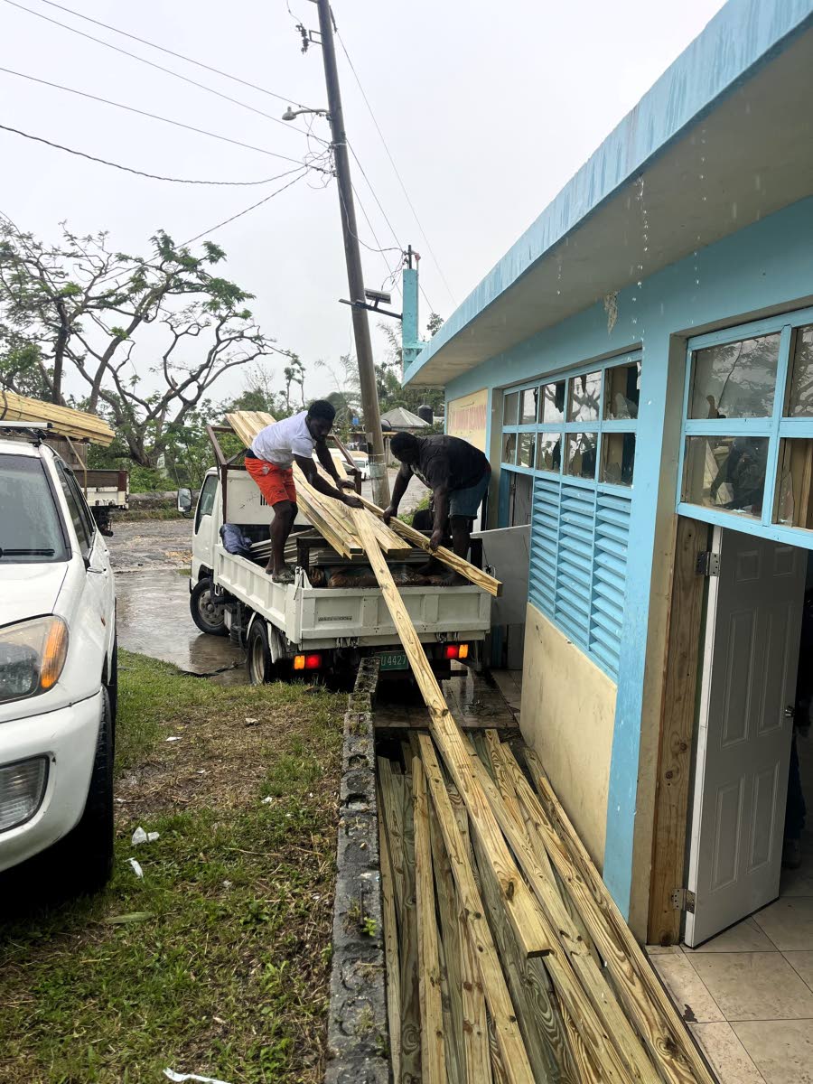 Residents are seen assisting in rebuilding efforts in Maryland and Cottage Road, as part of the JMMB Joan Duncan Foundation’s Community Restart Project .
