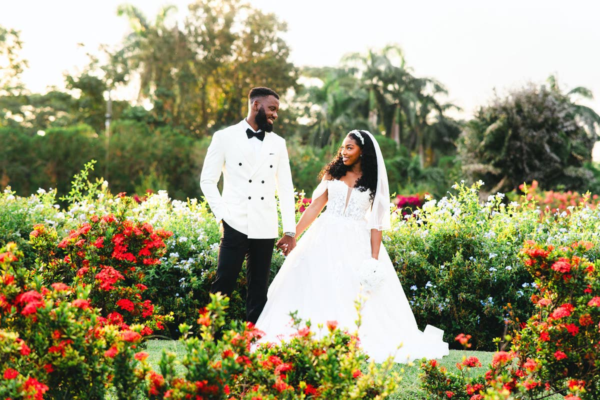 Surrounded by lush beauty and bountiful flowers, the newlyweds bask in the nuptial bliss of becoming Mr and Mrs.