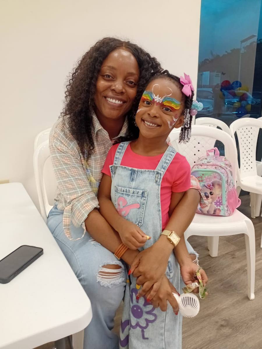 Starr, with her four-year-old daughter, Autumn, after she got her face painted at TruFun Play’s opening on Saturday.