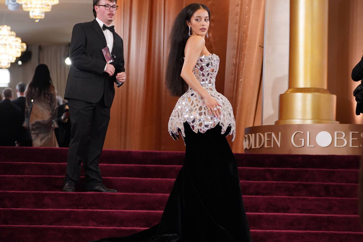 Chase Infiniti mirrors the star-studded carpet in a custom Louis Vuitton corset gown.