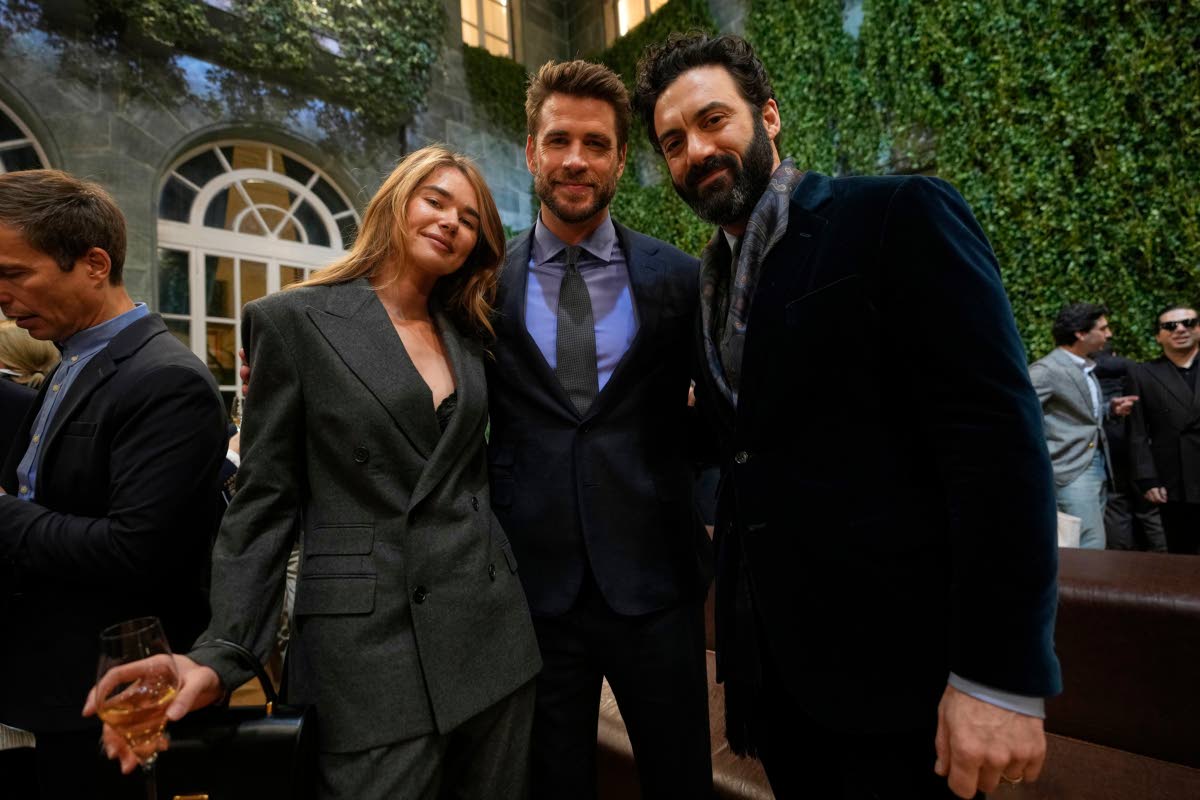Liam Hemsworth (centre) is flanked by his girlfriend, model, Gabriella Brooks, and Morgan Spector (right), as they attend Ralph Laurent Fall/Winter 2026-2027 Men’s fashion show presented in Milan, Italy.