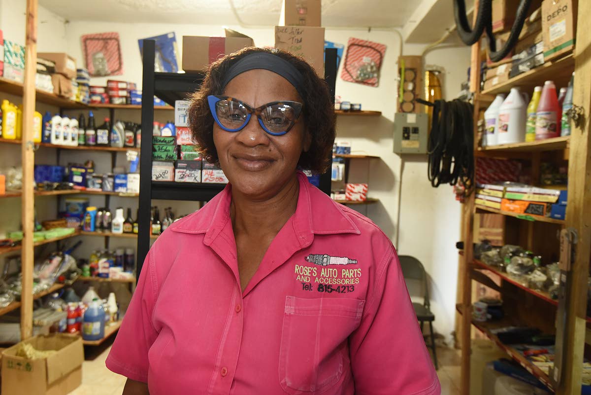Annmarie Rose, who operates Rose’s Auto Parts and Accessories, was all smiles last Wednesday but vividly recalled how floodwaters ran through her store, destroying her stock, nearly three months ago.