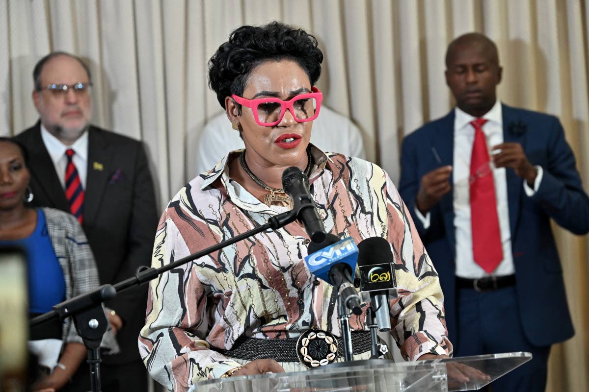 Left: Hanover Eastern MP Andrea Purkiss speaking of the damage done to her constituency by Hurricane Melissa at a PNP press conference last November.