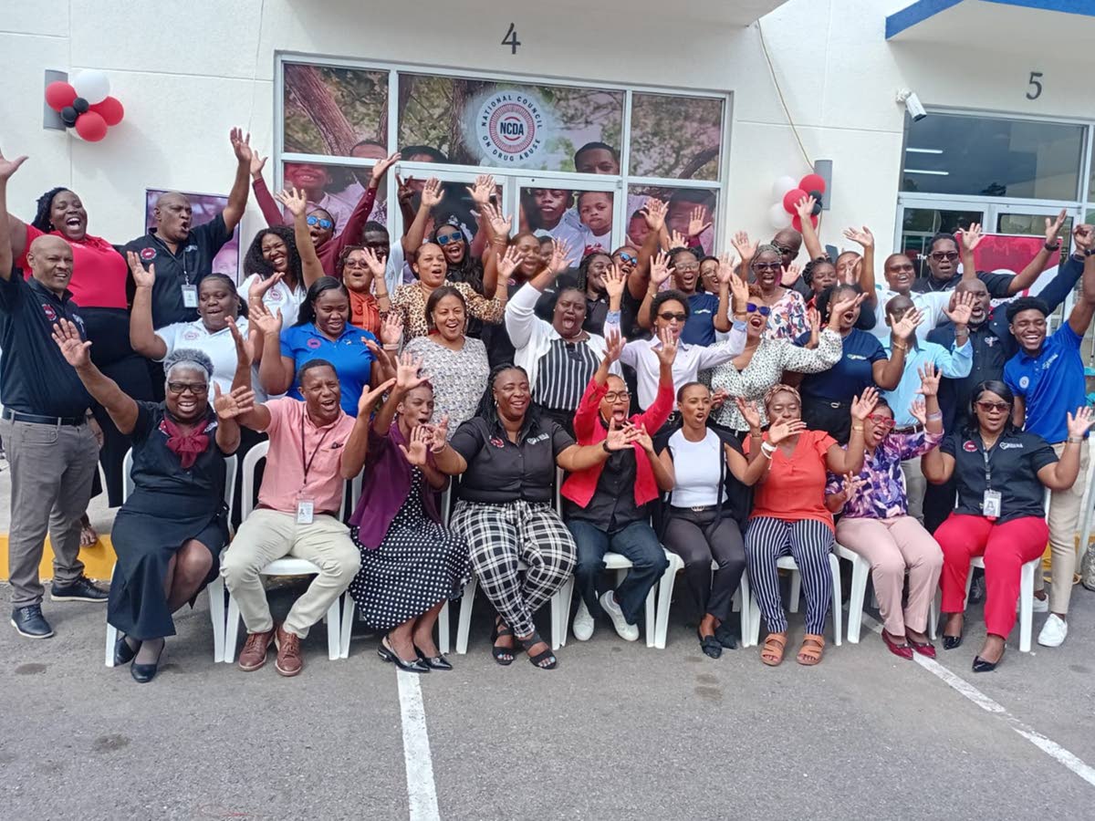 Executive Director of the National Council on Drug Abuse, Paulette Spencer-Smith (fifth from left), and Regional Manager Nordia Henry (fourth from left), with the team at the NCDA North East Regional Office opening last Friday.
