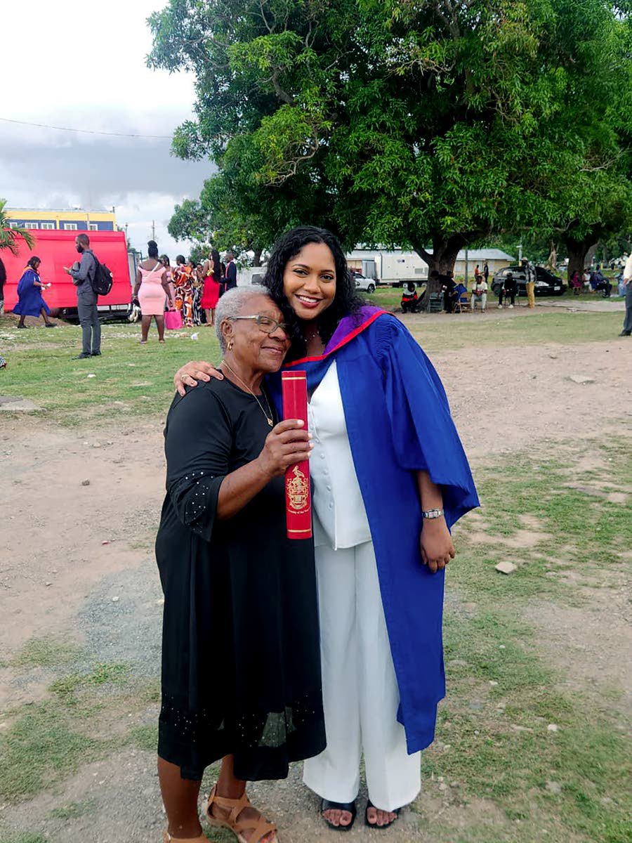 Joan Crooks (right) embraces her granddaughter Marianna Crooks at her graduation last week at The University of the West Indies, Mona.