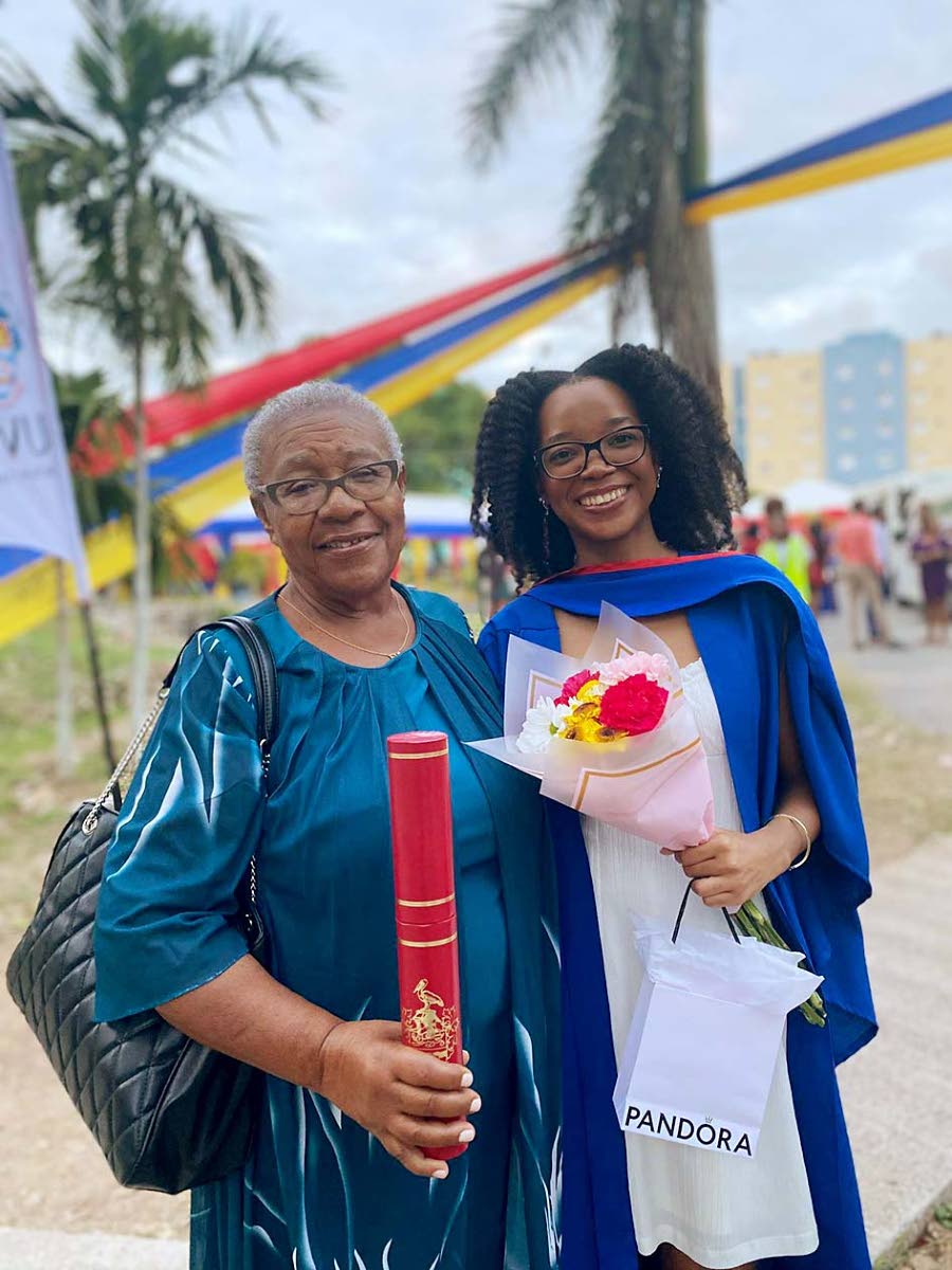 Joan Crooks (right) embraces her granddaughter Alana Paige Henry at her graduation last week at The University of the West Indies, Mona.