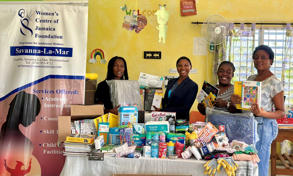From left: Mellisa Boothe-Anderson, centre manager; Ashley Simms, regional public relations manager (Sandals Negril); Stacey-Ann Reid, counsellor; and Claudia Lindsay posing with a portion of the donations made by the Sandals Foundation, Pack for a Purpose