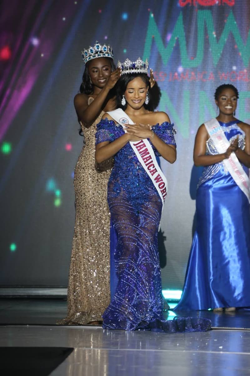 The new Miss Jamaica World Nevaeh Allen is crowned by Miss Jamaica World 2024 Tahje Bennett (left) during the competition’s grand coronation on Sunday night at the Karl Hendrickson Auditorium at Jamaica College.