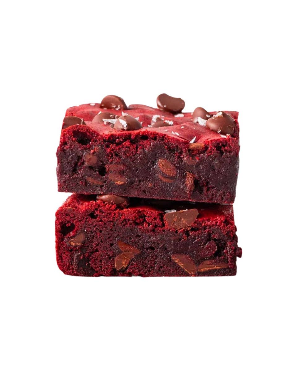 The red velvet brownie delivers a soft, cocoa-infused crumb finished with a subtle sweetness and velvety texture.