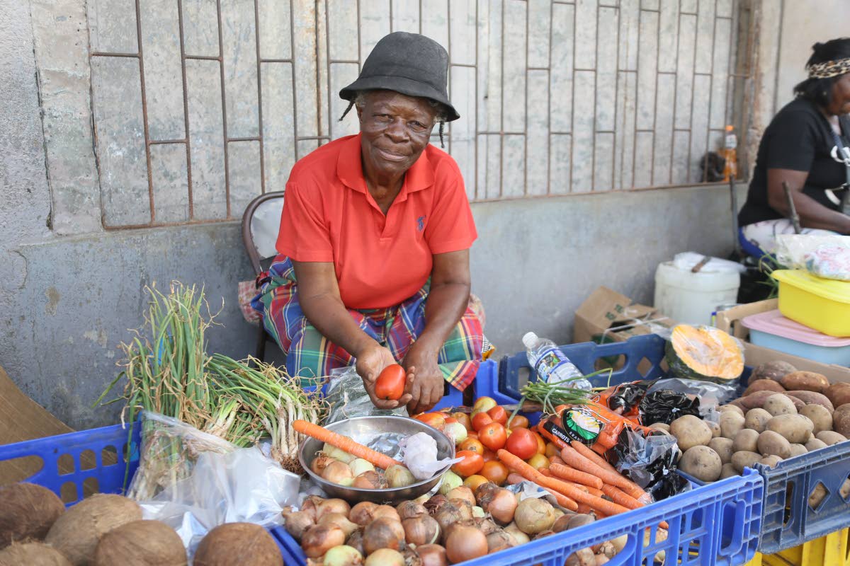 Thelma James, a farmer from Frankfield, Clarendon, sells produce in Frankfield Square after Hurricane Melissa last year.