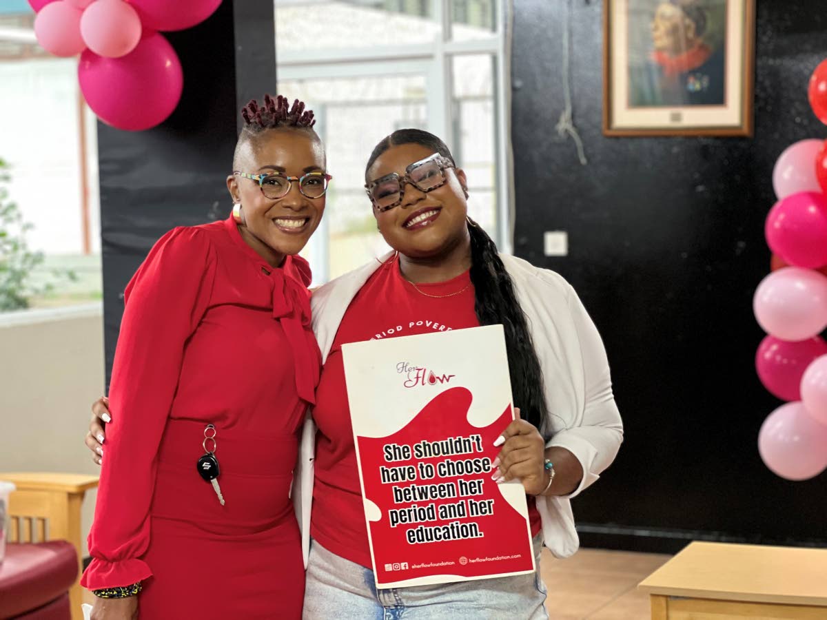 Sabrina Barnes (right) poses for a photo with Shellyann Weeks at the launch of the Period Panty pilot project at UWI, Mona.