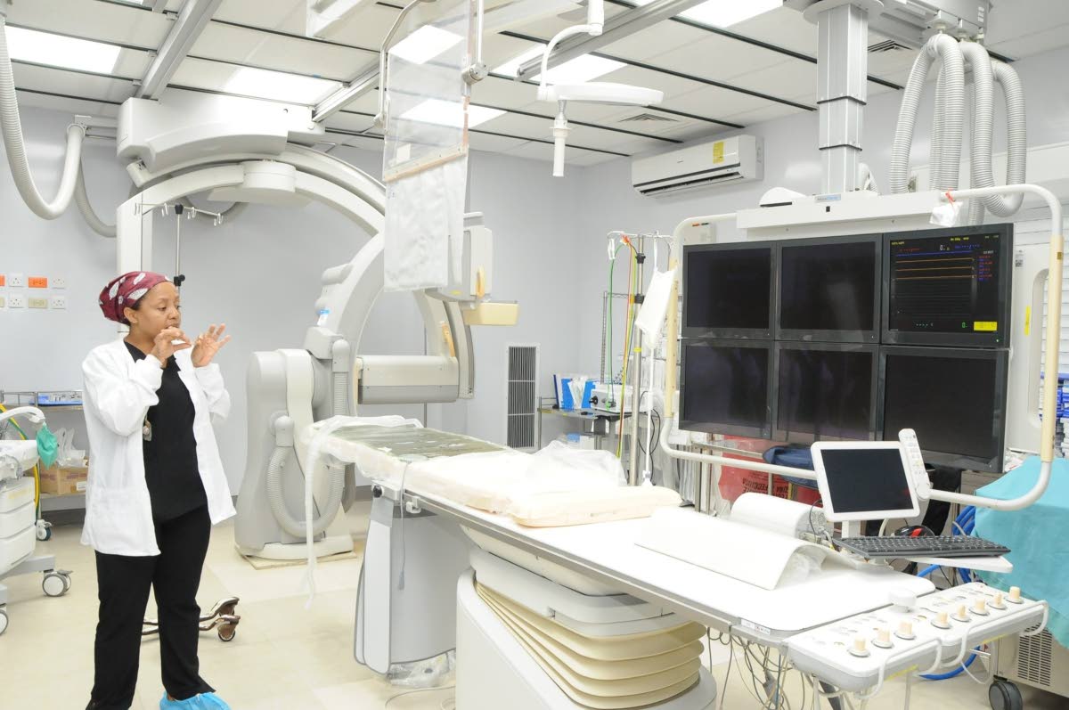 Dr Cleopatra Patterson, paediatric cardiac anaesthetist and intensivist at the Bustamante Hospital for Children (BHC), showcases a procedure room at the BHC, designed for minimally invasive, cardiac procedures during a tour of the facility by a 16-member v