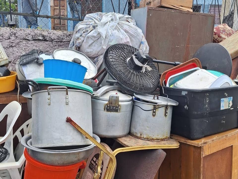 Items removed from Rhodes Nursing Home are seen on the Half Way Tree Road sidewalk during a court-sanctioned eviction on February 3, 2026. 