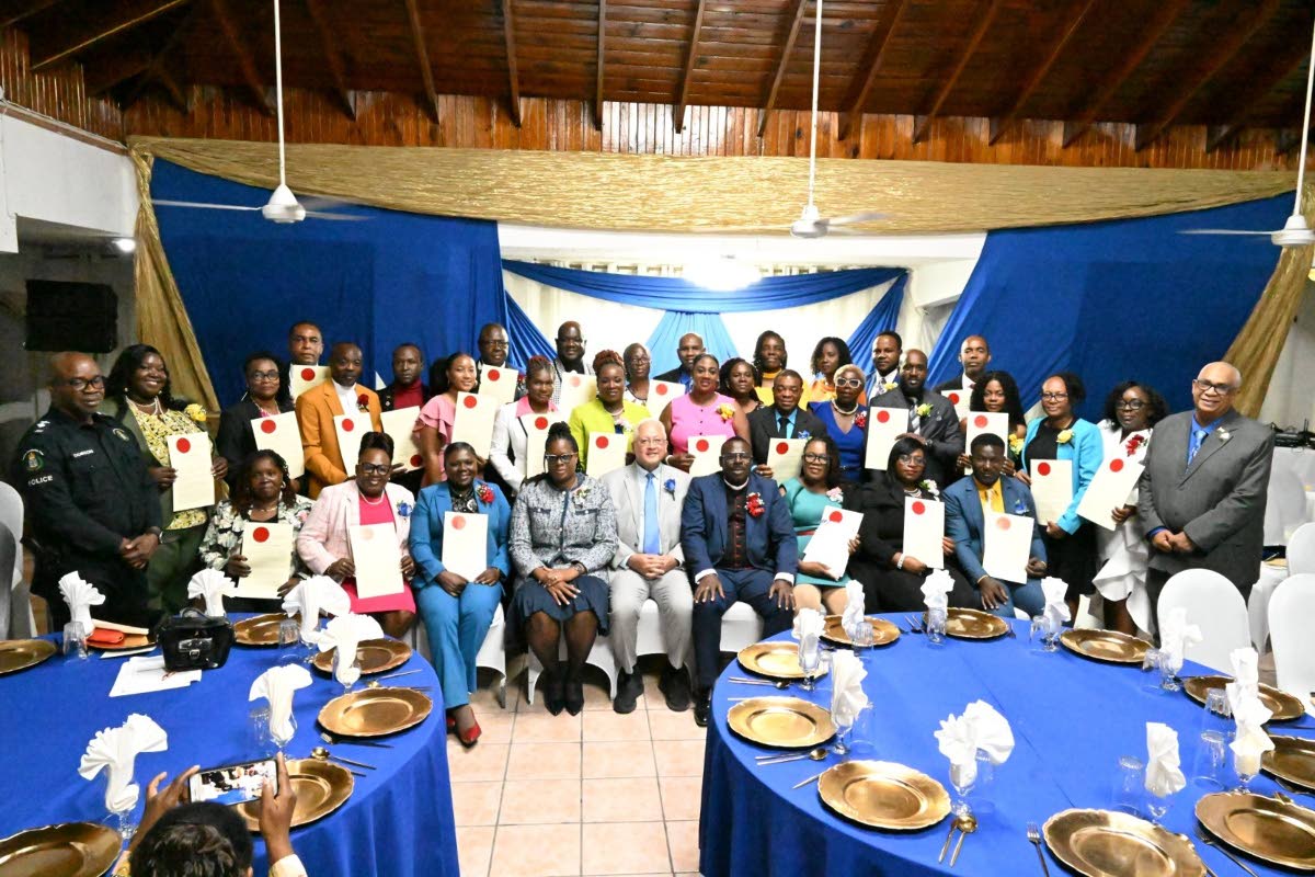 The newly commissioned justices of the peace in Westmoreland share the spotlight with Justice Minister Delroy Chuck and other dignitaries.