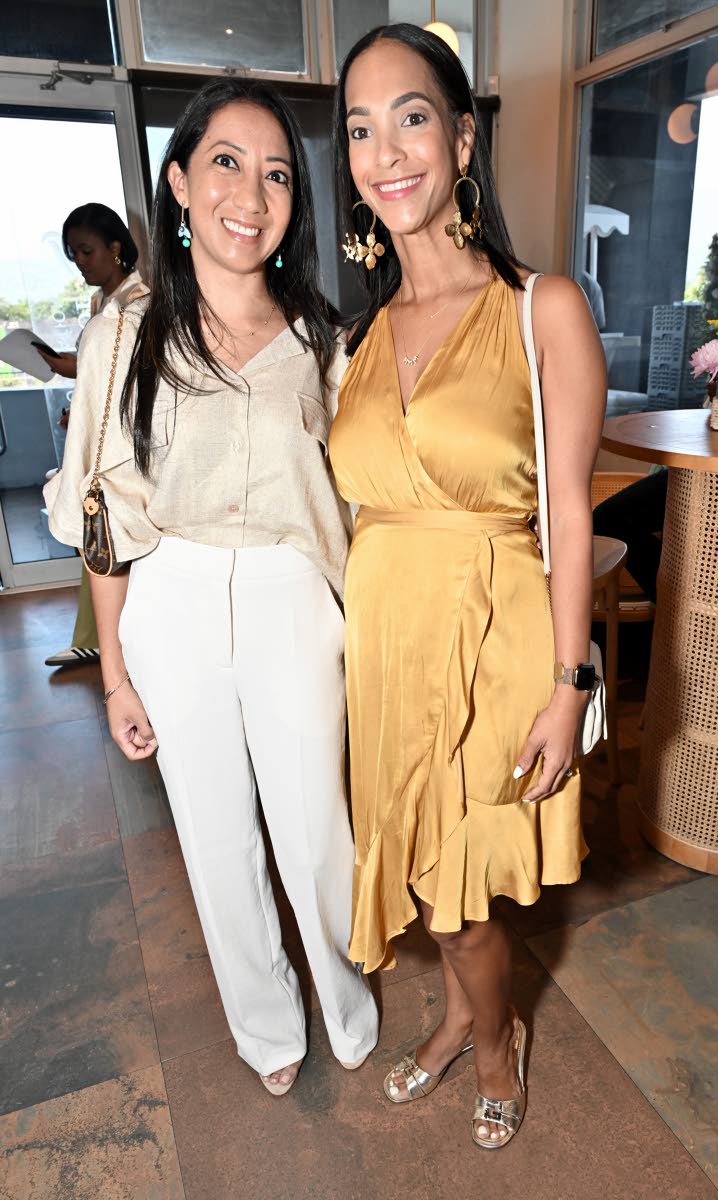 Bianca Nam McDaniel (left), vice-president, wealth and corporate relationship management at Sagicor, is all smiles, snapping a pic with gal pal Melanie Levy, chief executive officer of Candy Craze.