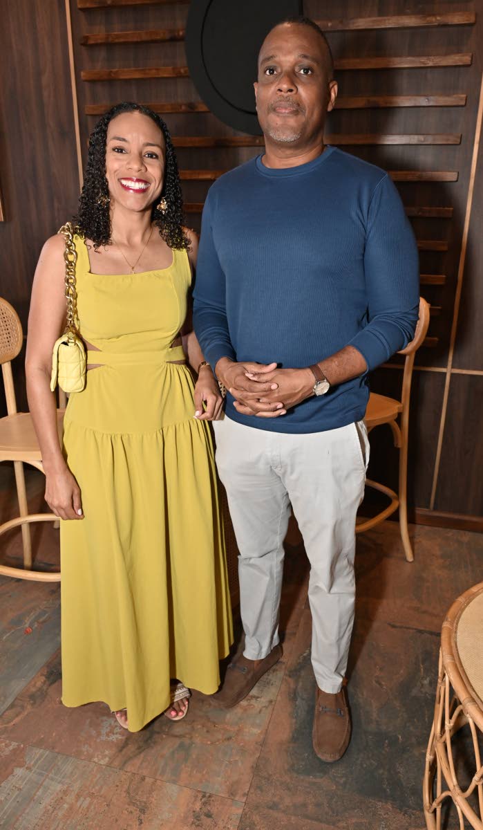 Tracy Spence,  executive vice president and chief investment officer at Sagicor, pairs up with Managing Director of Fesco, Jeremy Barnes, for a quick photo.