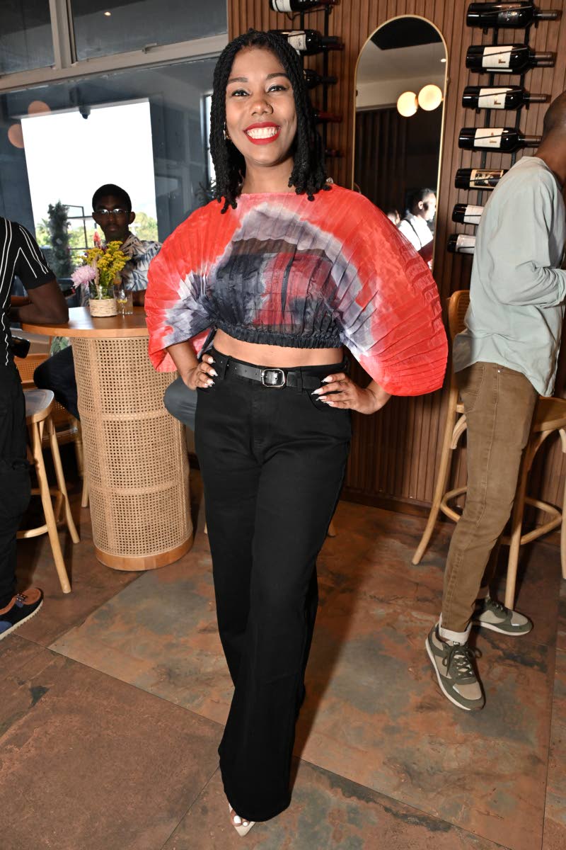 Megan Edwards, corporate social responsibility officer at Sagicor Group, catches our attention in a crop top from the Clothing Refinery, paired with high-waisted black trousers from Ammar’s.