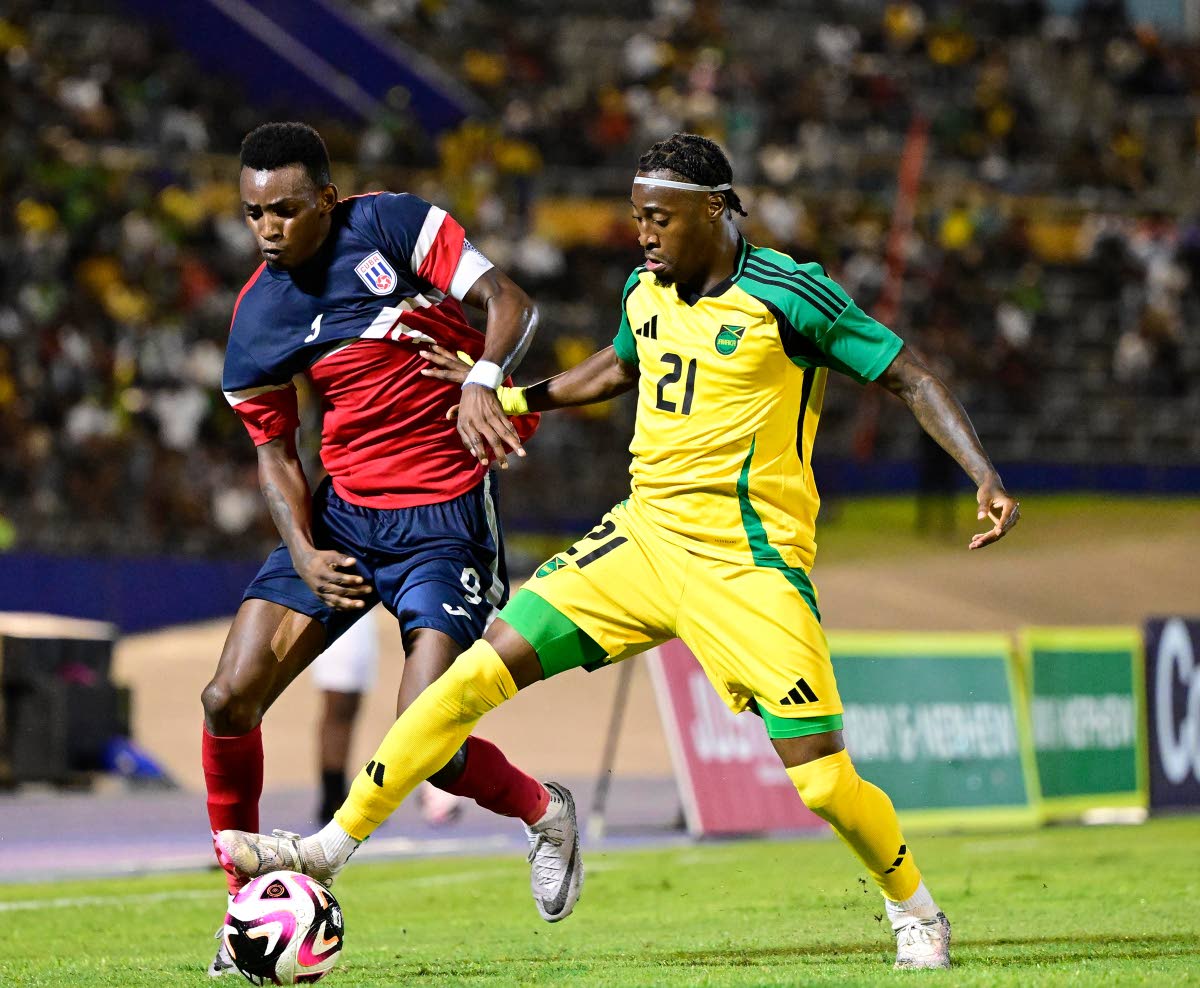 Reggae Boy winger Norman Campbell tries to get between Cuba’s Maikel Reyes and the ball during a Concacaf Nations League, League A, Group B game inside the National Stadium on September 6 2024.