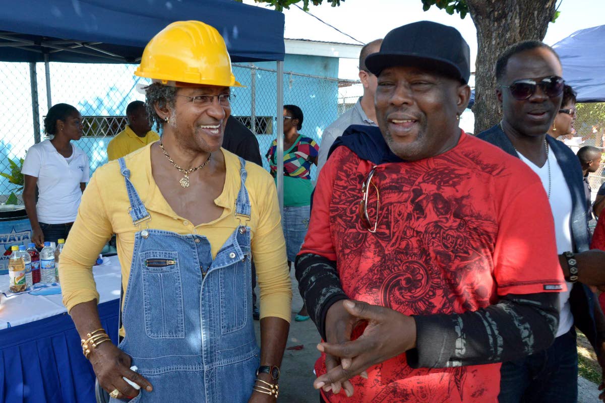 Sly Dunbar (left) rocks his famous construction hard hat, with Robbie Shakespeare at the General Penitentiary in 2013 during Shaggy’s performance for the inmates.